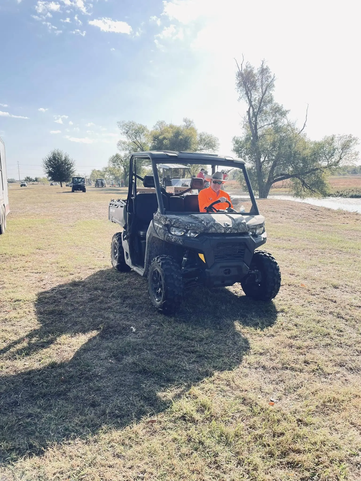 A man riding on the back of an atv.