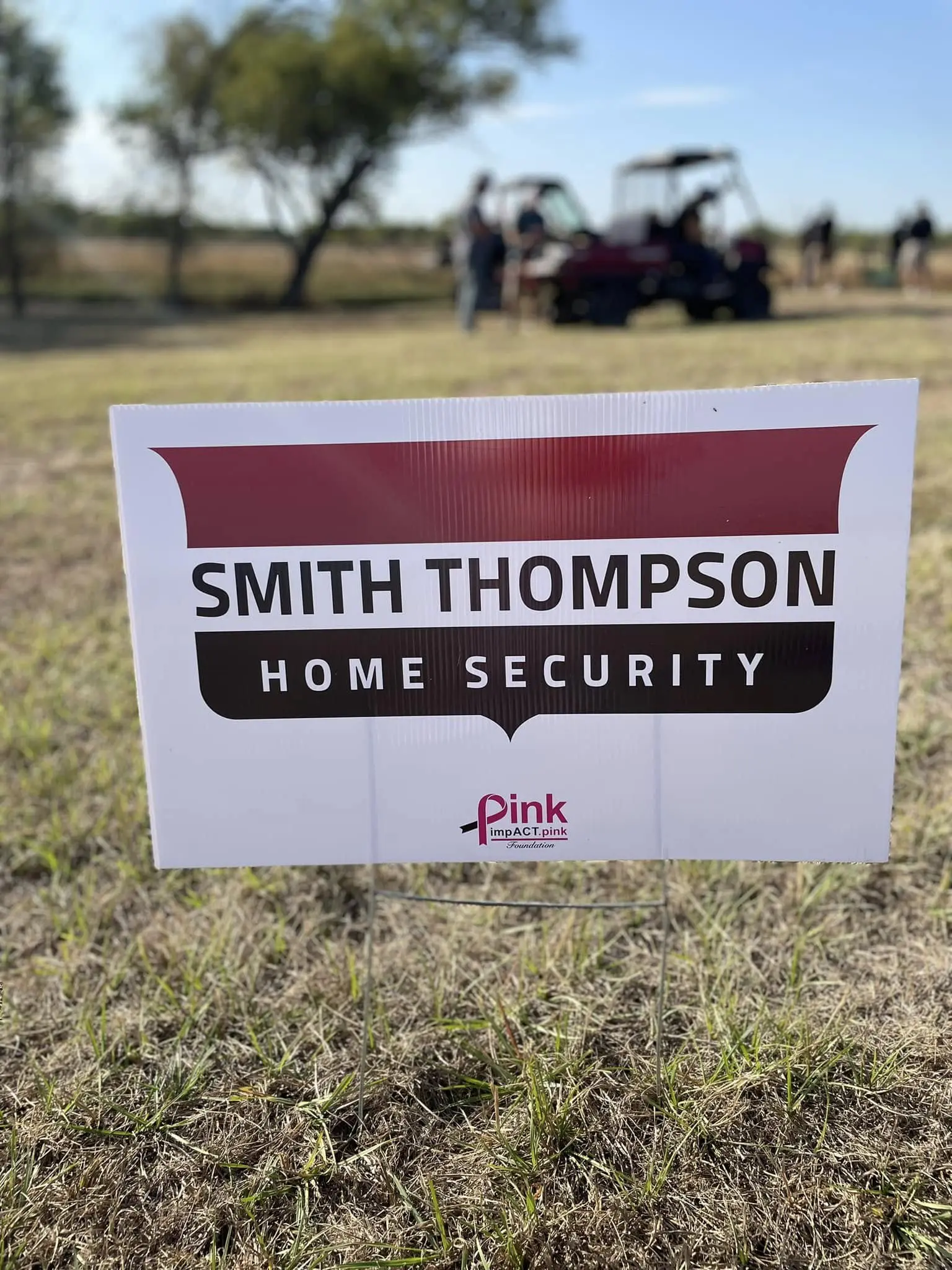 A sign that says smith thompson home security.