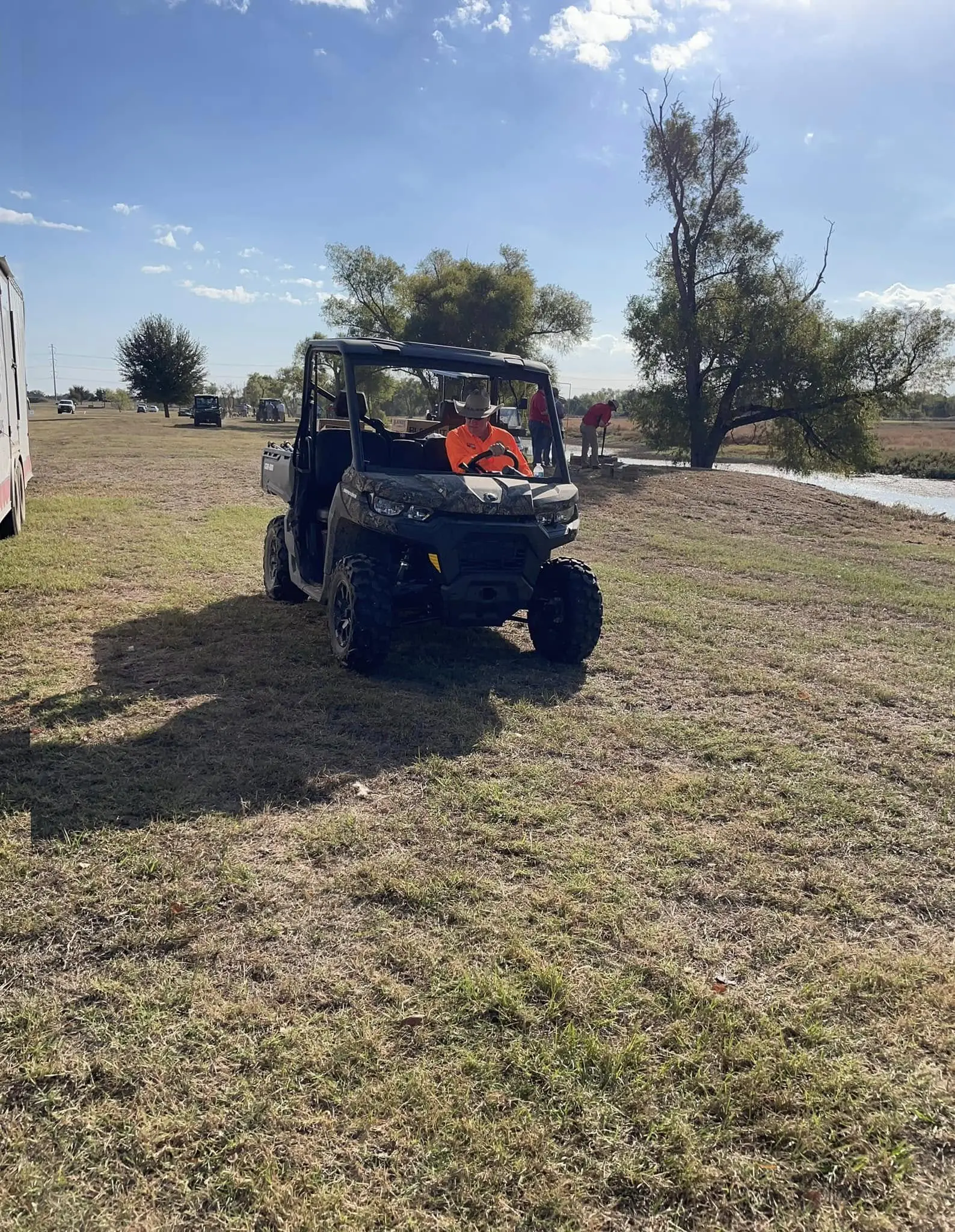 A man riding on the back of an atv.